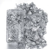 A clear jar filled with shiny gold foil flakes for resin art and jewelry making