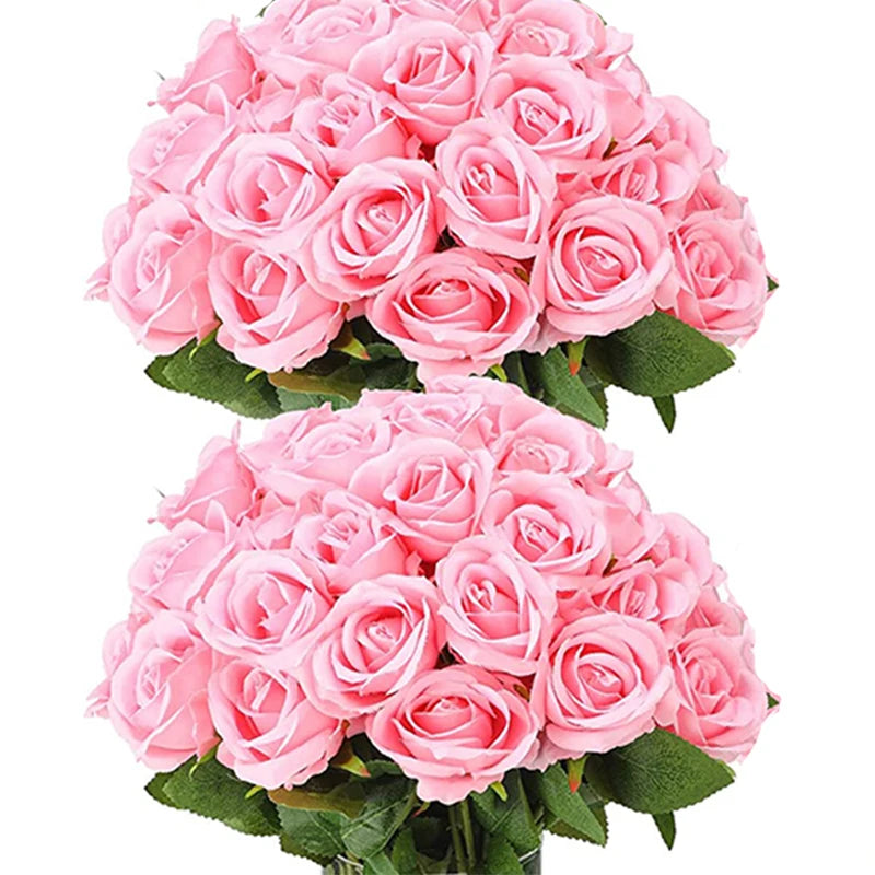 A bouquet of pink artificial roses with green leaves.