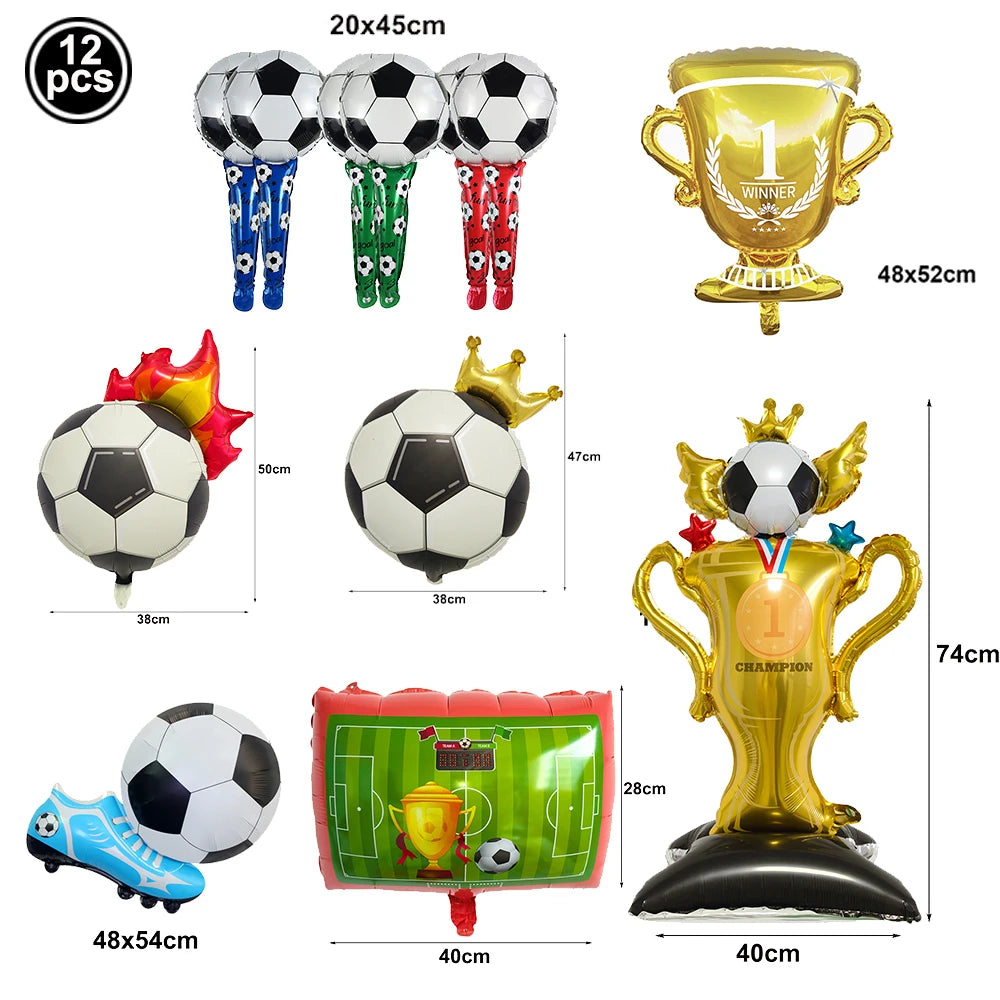 A collection of soccer-themed party decor including balloons, a gold trophy, and a football-shaped item.