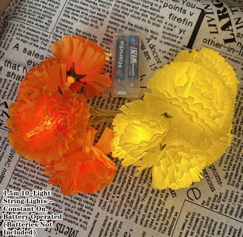 A close-up of bright yellow LED marigold string lights resting on a page of printed text.