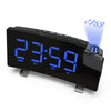 A black projection alarm clock with a blue LED display showing 23:59 and various function buttons.