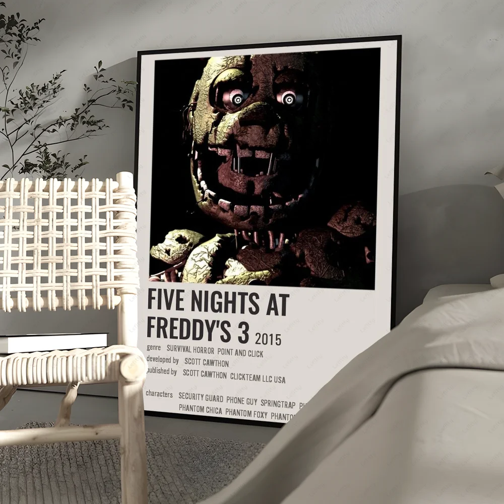 A framed poster featuring a terrifying animatronic face from Five Nights at Freddy's 3