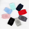 A collection of colorful knitted knee pads arranged in a circle.