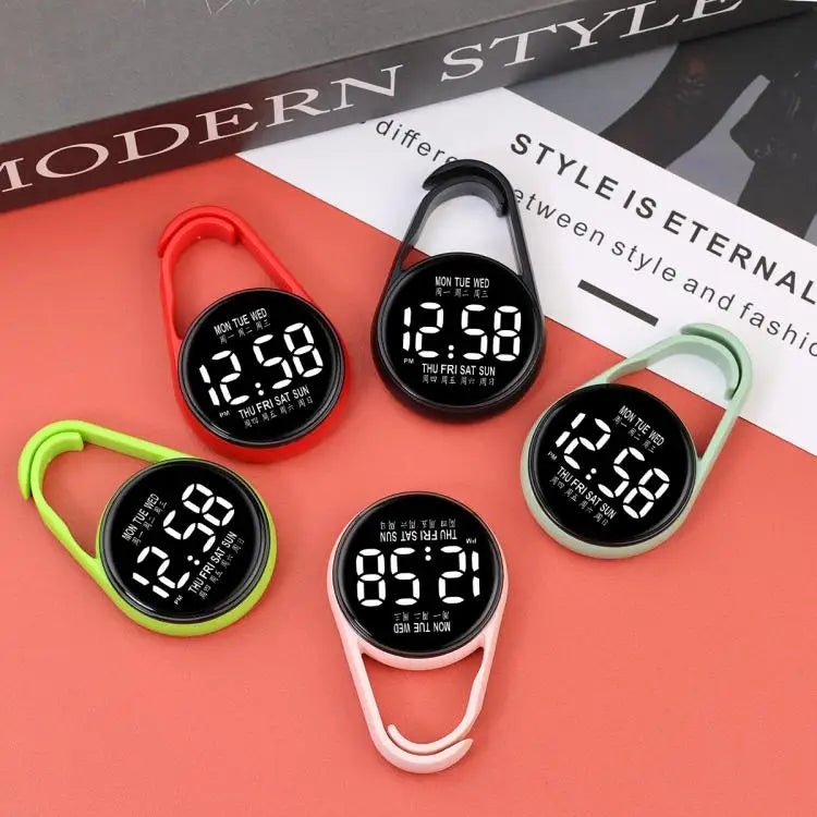 A collection of LED pocket watches in various colors, including red, black, and green, displayed on a red background.