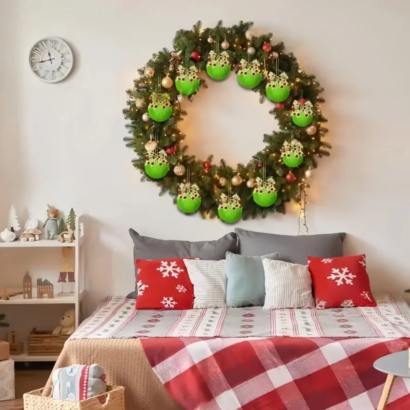 A wreath of green pine branches decorated with faux fur Christmas ball ornaments and bows on a white wall.