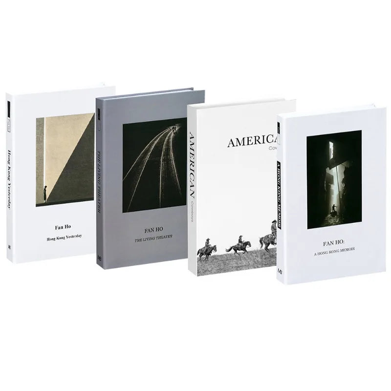 A set of three decorative faux books featuring black and white photography for home decor.