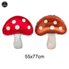 Two inflatable mushroom decorations, one red and one copper, with white polka dots.