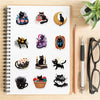 A pack of cartoon black star cat PVC stickers for DIY crafts and scrapbooking displayed on a spiral-bound notebook.