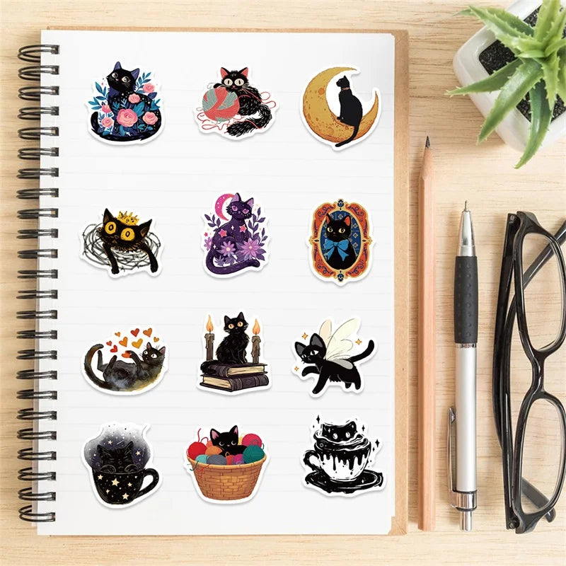 A pack of cartoon black star cat PVC stickers for DIY crafts and scrapbooking displayed on a spiral-bound notebook.