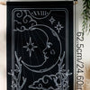 Black sun and moon boho wall tapestry featuring a line drawing of the moon and stars