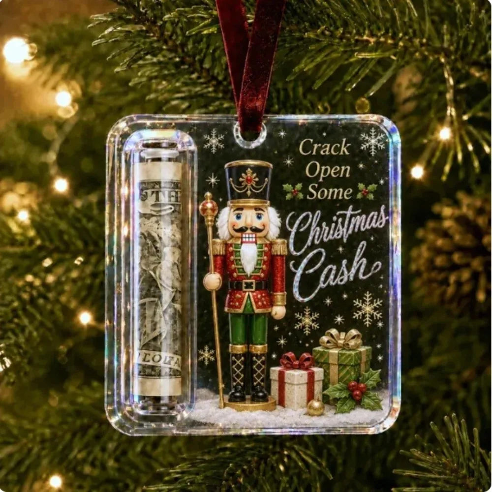 Clear acrylic ornament featuring a festive elf figure and Christmas cash theme hanging on a green Christmas tree.