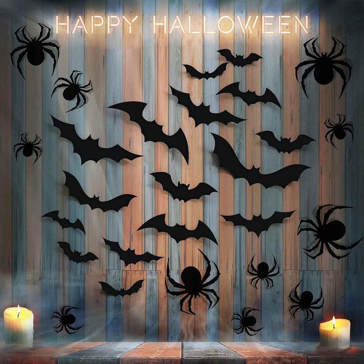 A display of black bat and spider silhouettes on a wooden wall for Halloween décor.