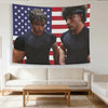A poster featuring two muscular men in black shirts against an American flag background.