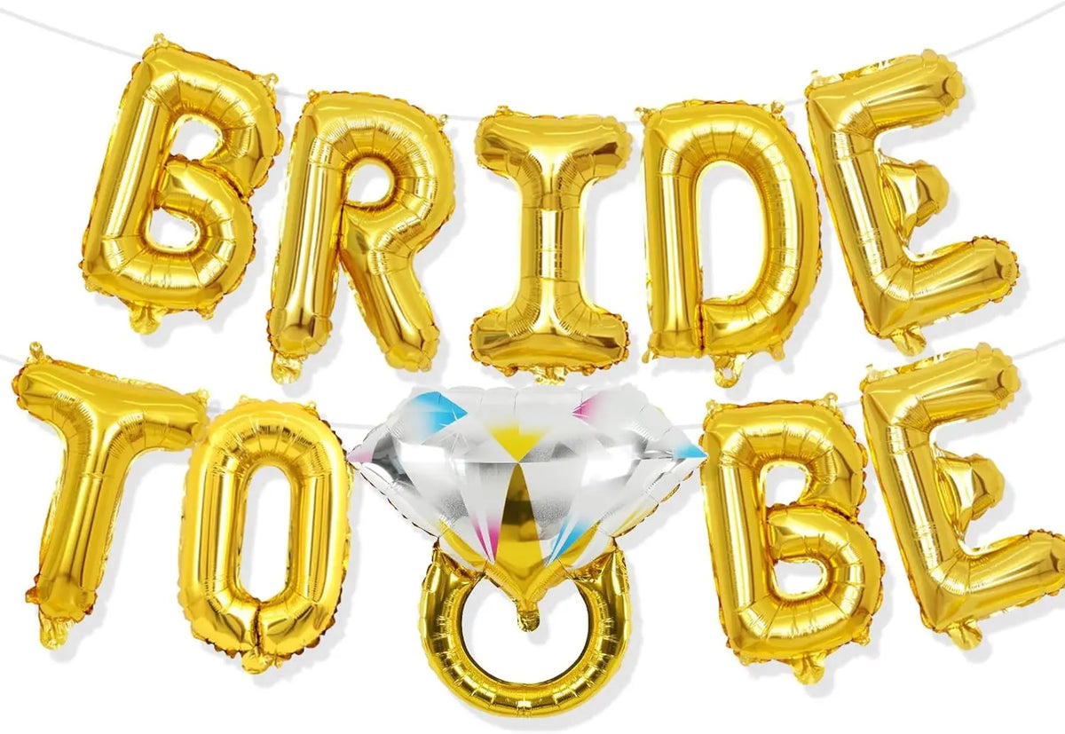 A gold foil balloon banner spelling the word BRIDE TO BE