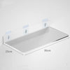 Clear acrylic floating shelf with wall mounts shown mounted on a white wall.