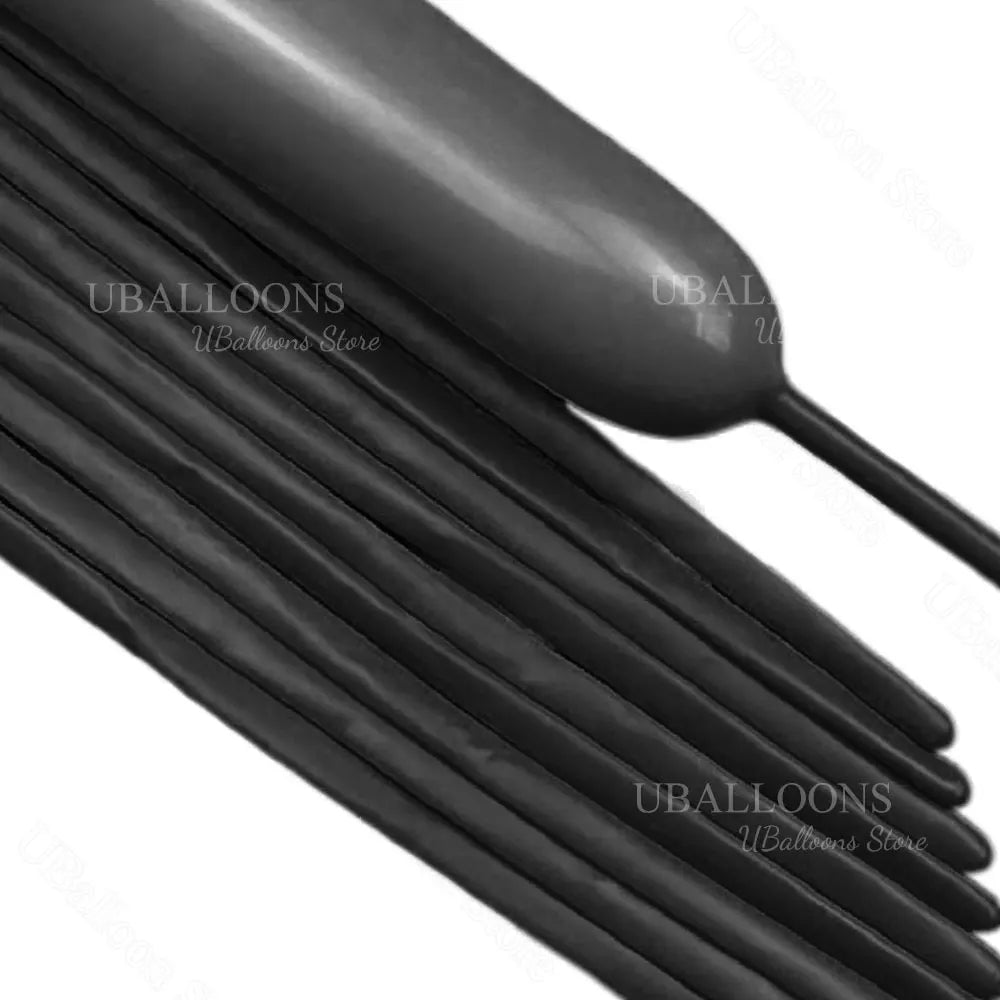 A close-up view of black magic twisting balloons arranged in a bundle.