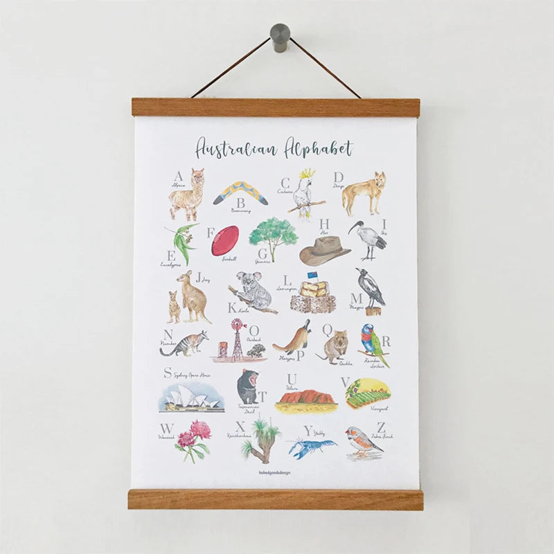 A wooden art frame displaying the Australian alphabet with illustrations for each letter.