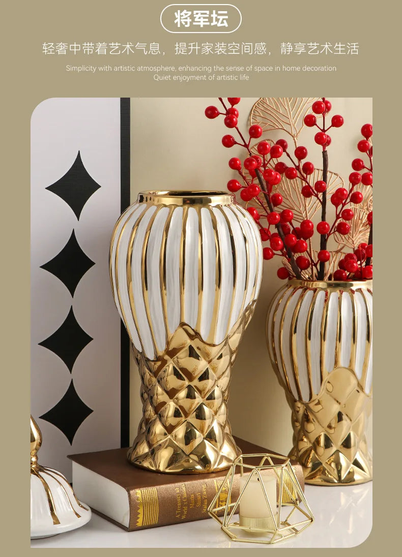 A golden ceramic decorative vase with white stripes holds red berries and branches on a light background.