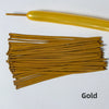 A collection of gold latex strip balloons and a yellow balloon are displayed on a white background.