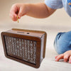 A wooden money saving box with a built-in goal tracker showing various savings amounts.
