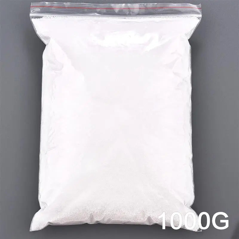 A white bag filled with sand pigment used for a handmade candle wax kit.
