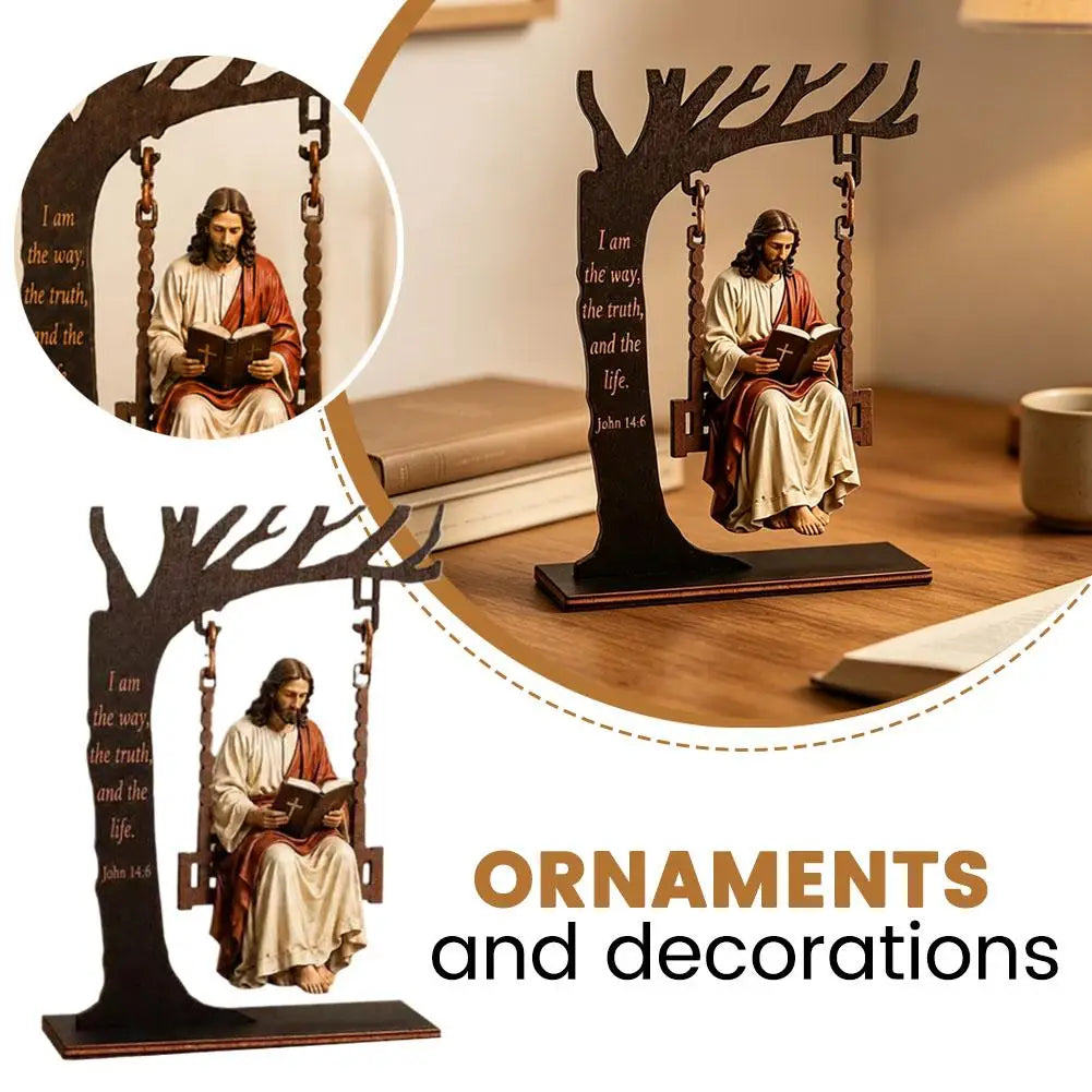 Wooden ornament depicting Jesus reading the Bible in a hanging frame on a desk.