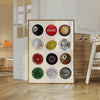 A framed canvas wall art poster featuring various round balls and circular designs in black, red, gold, and green tones.