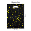 A black paper bag featuring a pattern of yellow stars, sold in a lot of 10 pieces.