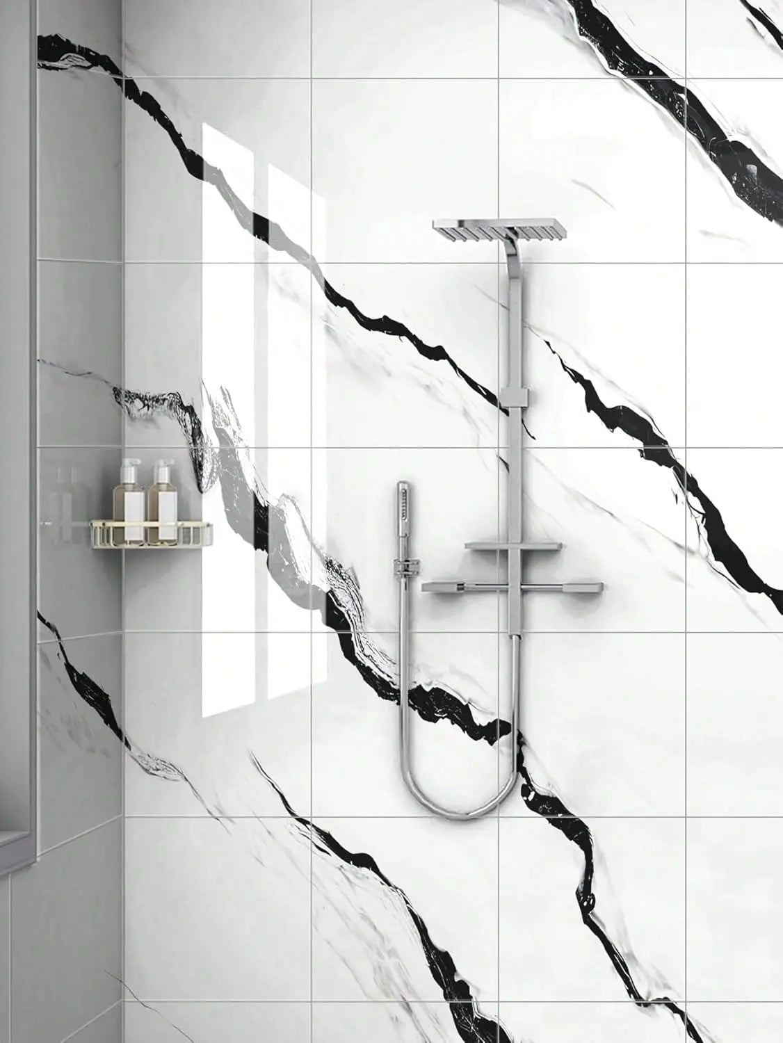 A modern bathroom wall featuring white marble tile with black veining and a chrome shower fixture.