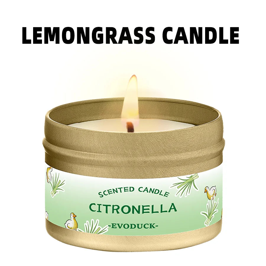 A jar of citronella lemongrass scented candle with a lit wick.