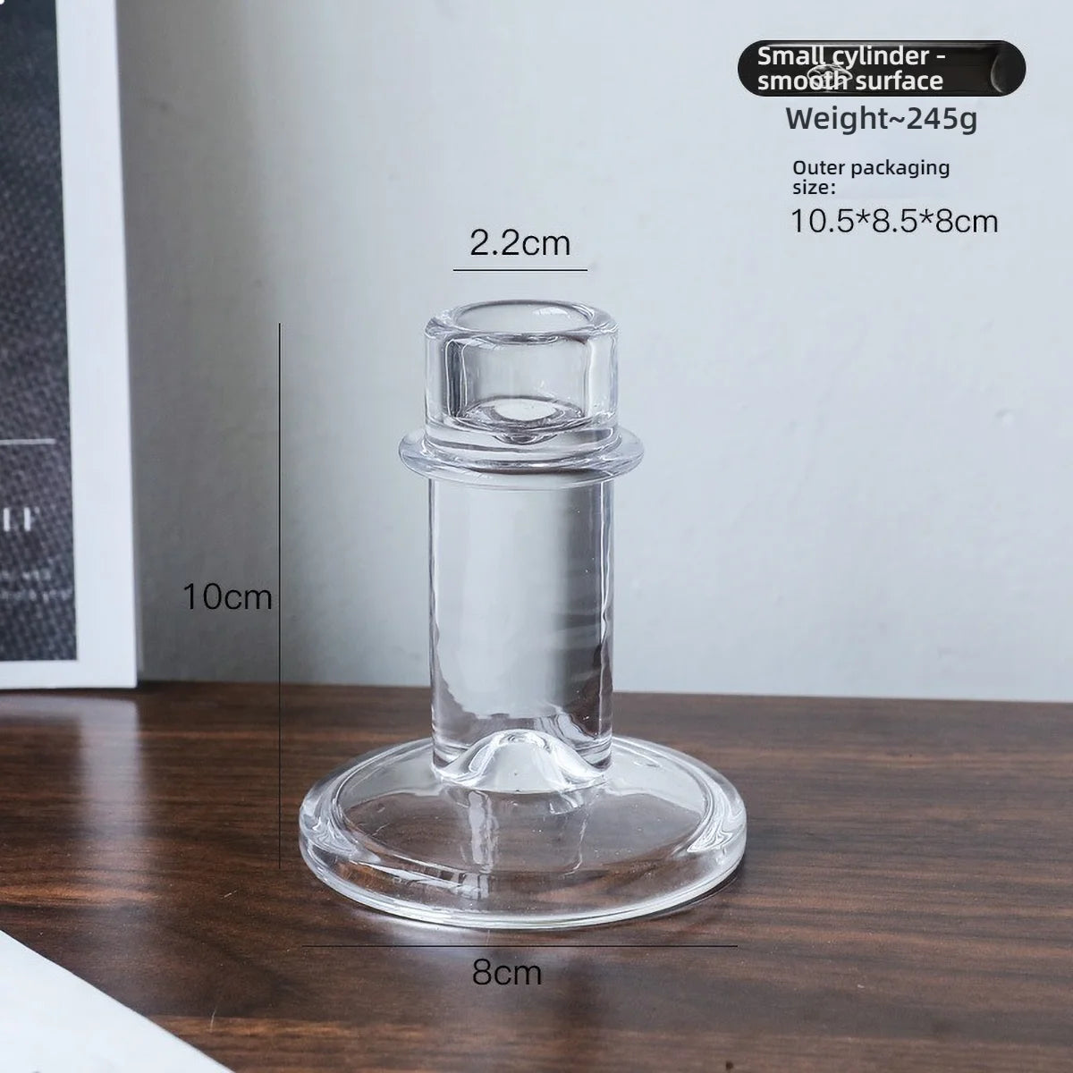 A clear glass pillar candle holder with a smooth surface, measuring 2.2cm in diameter and 10cm high.