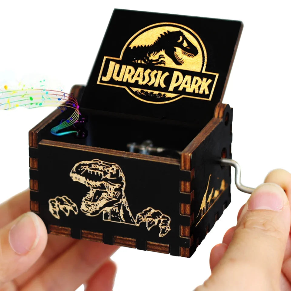 A carved wooden music box with an open lid featuring a Jurassic Park themed design.