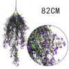 A long, cascading artificial plant vine wall hanging with purple flowers, measuring 82cm.