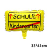 Gelonierte Luftballon mit schwarzem Text: Schule Kindergarten