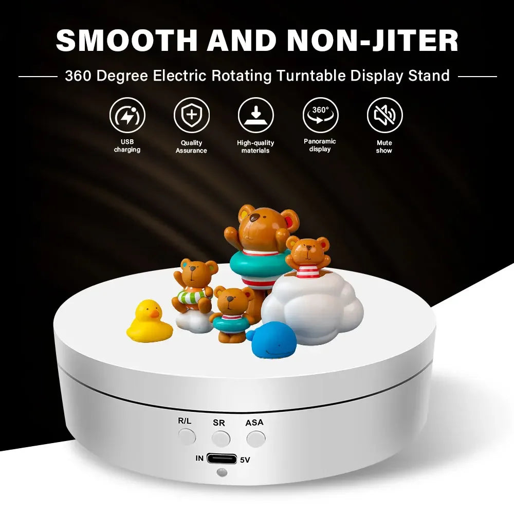 A white electric rotating turntable display stand featuring various stuffed toys on top.