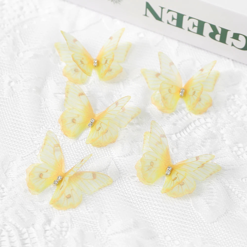 Several yellow butterfly patches are displayed on white fabric next to a green product box.