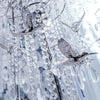 Clear crystal glass strands with silver accents and bird-shaped charms hanging in a vertical display.
