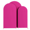 Three vibrant magenta spandex fitted wedding arch covers standing upright.
