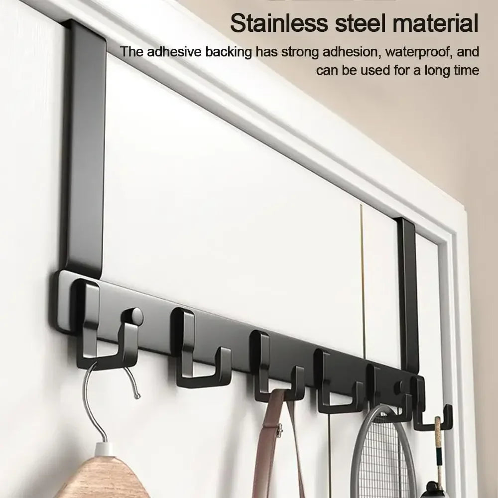 Black heavy duty aluminum door hooks with six capacity mounted on a white wall.