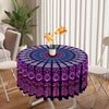 Bohemian peacock mandala round tablecloth featuring purple and pink patterns on a white table.