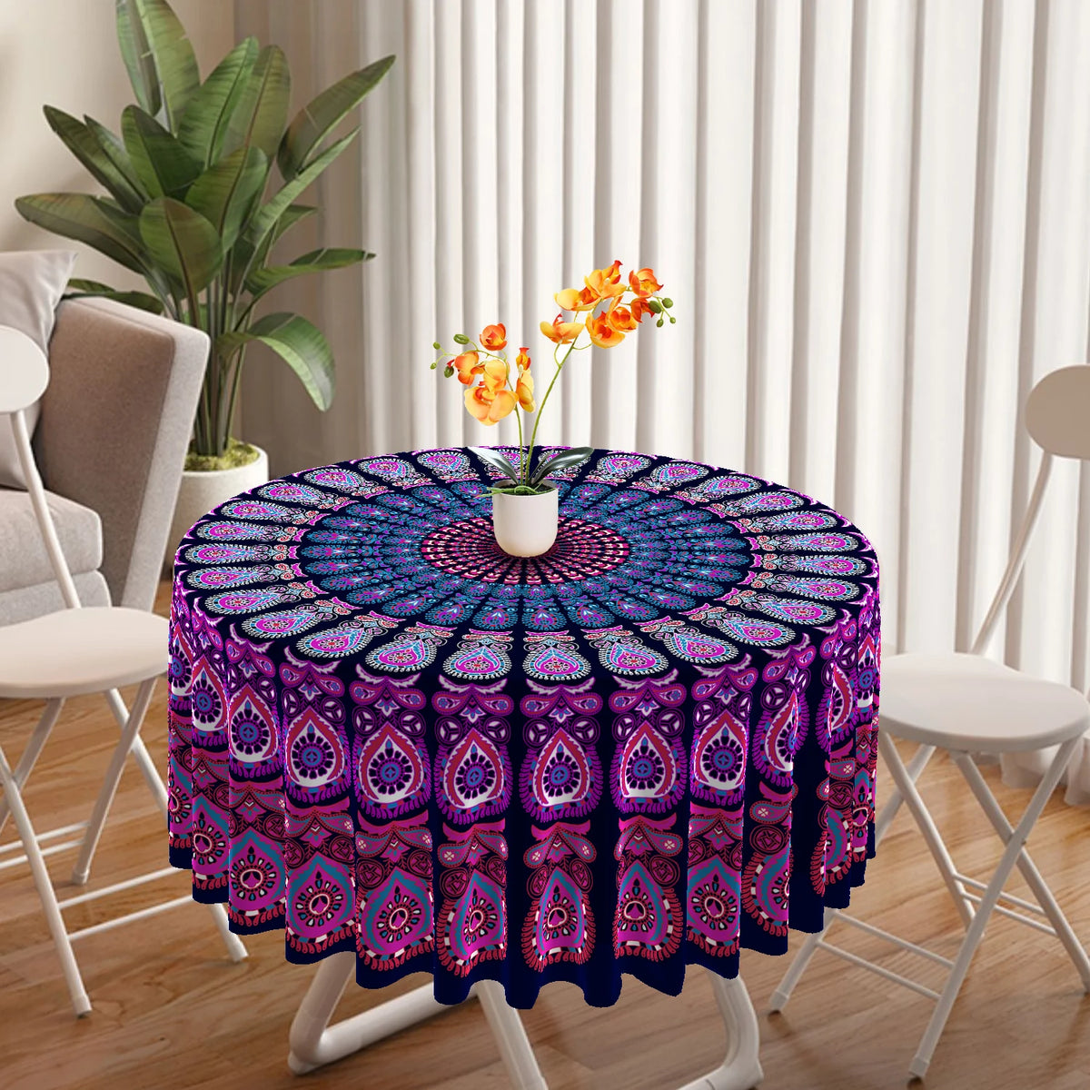 Bohemian peacock mandala round tablecloth featuring purple and pink patterns on a white table.