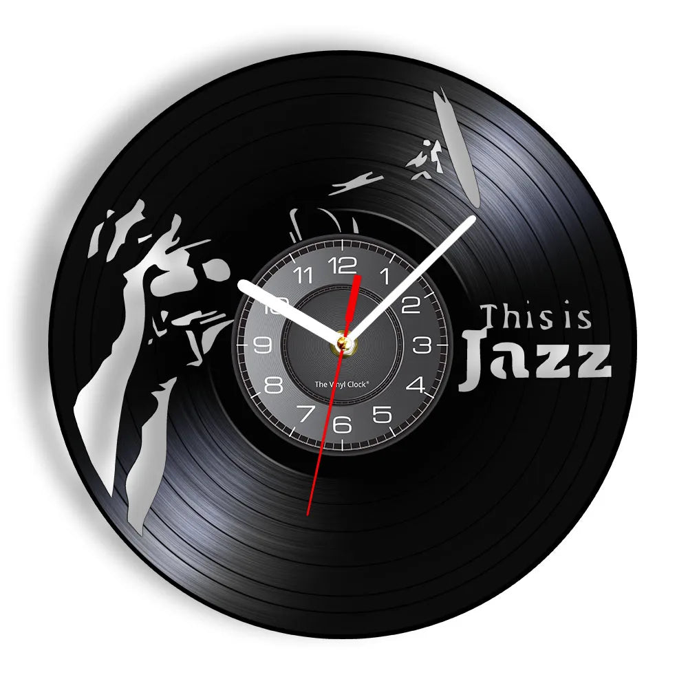 A black vinyl record is used as a wall clock with a white hand pointing to the twelve o'clock position.