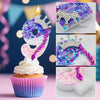 A set of gradient sparkle number birthday candles from 0 to 9 displayed on a cupcake.