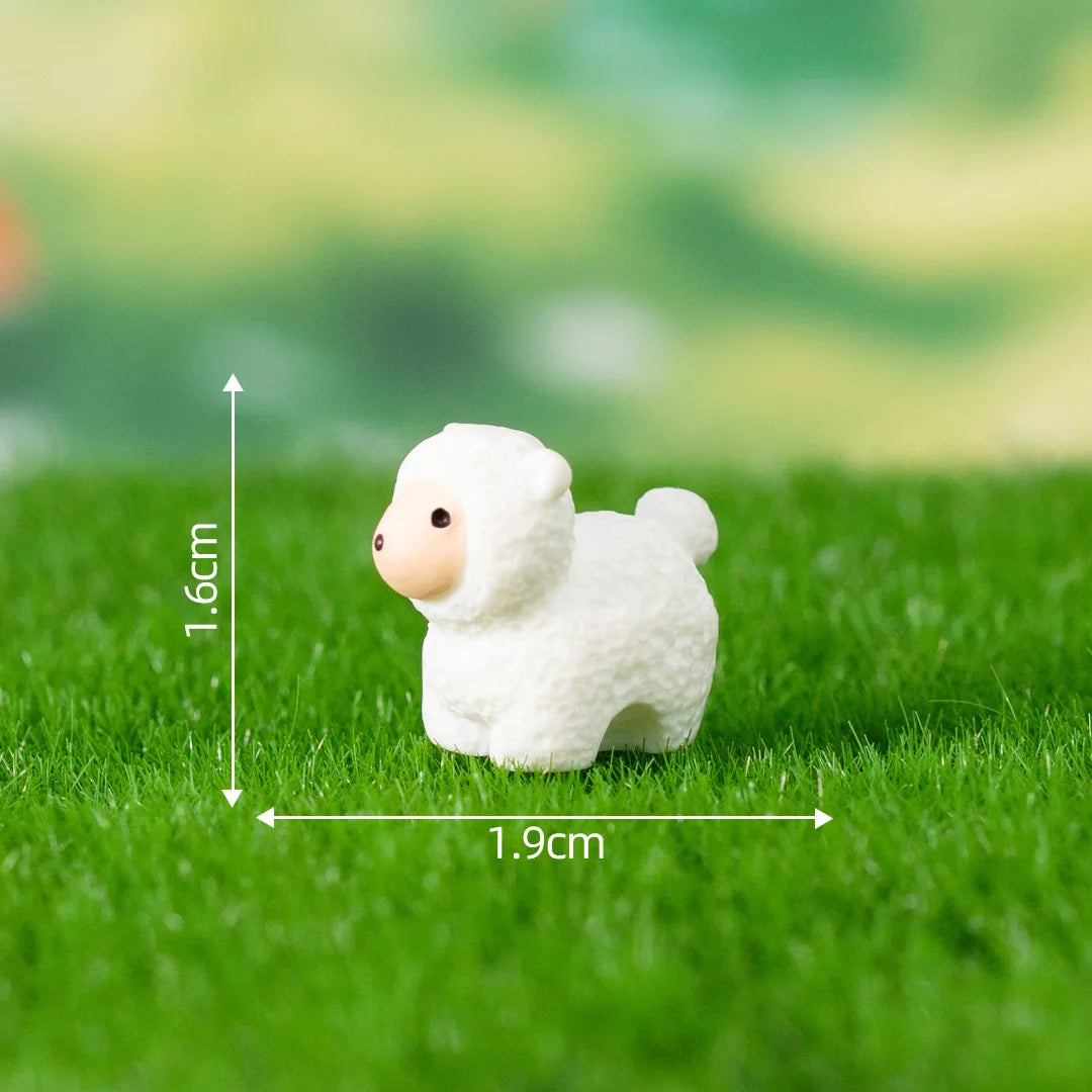 A small white fluffy animal figurine standing on green grass with measurement lines.
