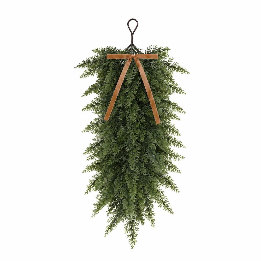 Artificial Christmas teardrop swag made of green Norfolk pine needles with a wooden hanger