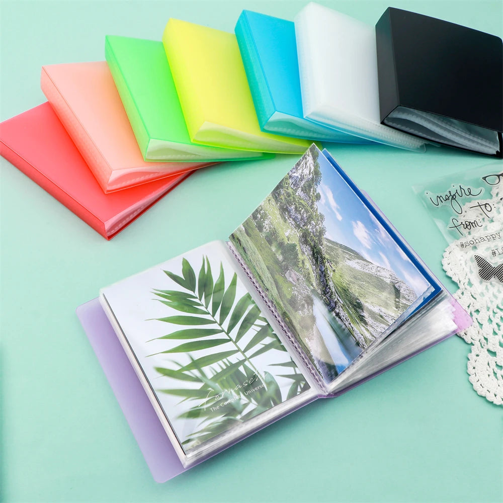 A clear A6 storage album with 40 pages is shown open, displaying a nature scene and a tropical leaf design.