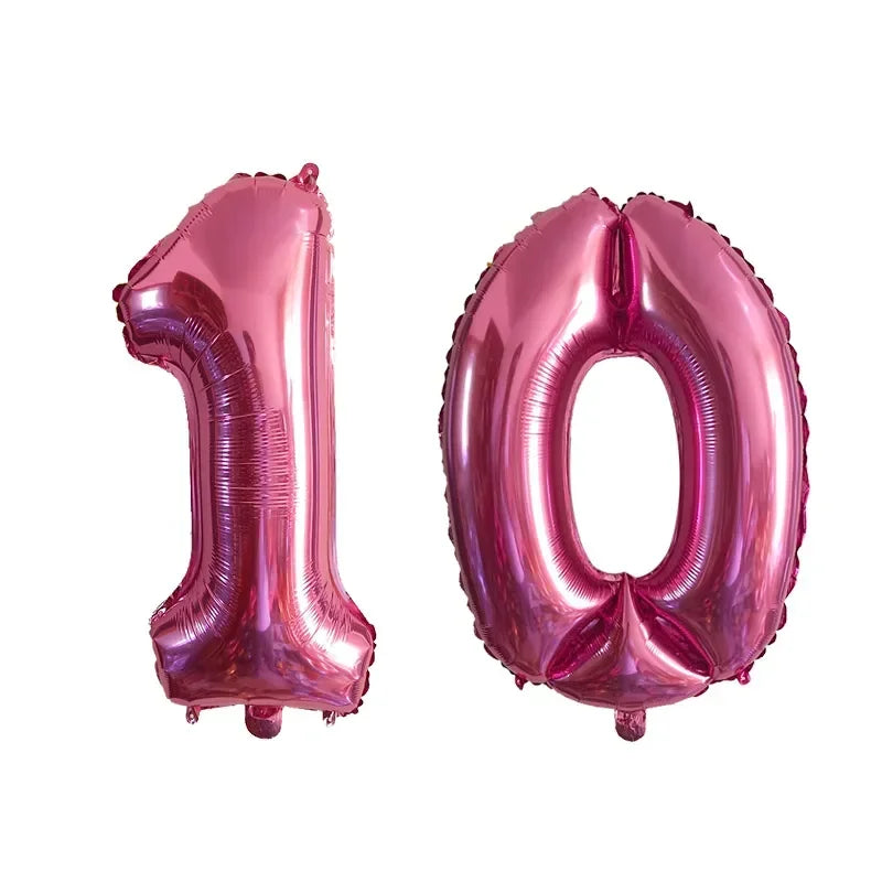 Two pink helium foil number balloons shaped like 10