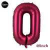 A single large, shiny magenta foil number balloon shaped like the digit zero.