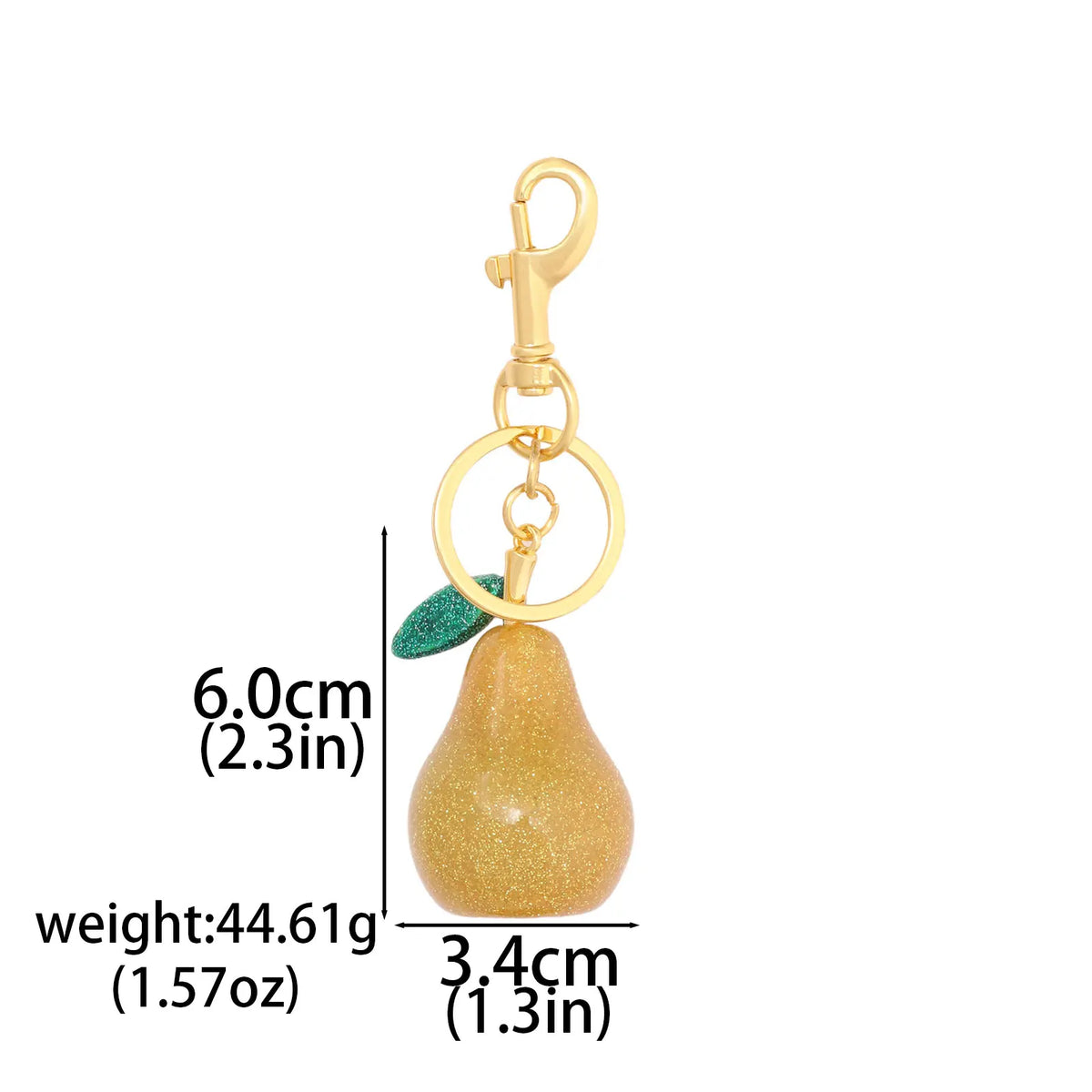 Gold-colored pear-shaped fruit keychain charm with a loop and green accent