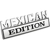 A silver metal emblem with the text MEXICAN EDITION engraved on a rectangular plaque.